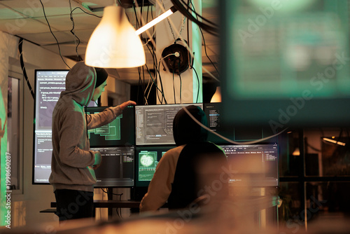 Fotografía Diverse men working together to break security server, planning data breach with malware and trojan virus
