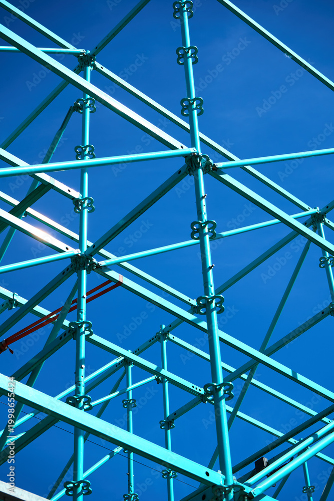 Fototapeta premium Geometric steel structure with clean blue background
