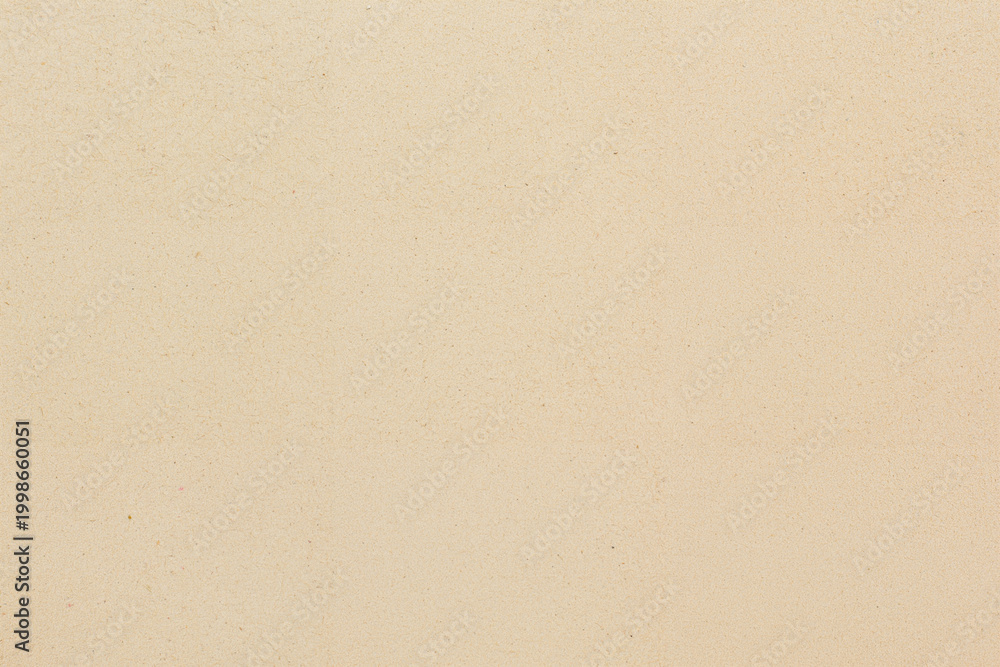 Obraz premium Finely textured beige paper surface exhibits subtle variations and visible fibers throughout its expanse.