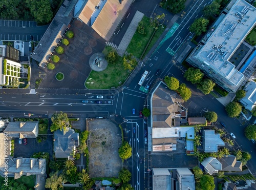 Aerial view of Parnell, Auckland, New Zealand, showing cars and a bus navigating city streets. The photo captures urban planning and transportation infrastructure.