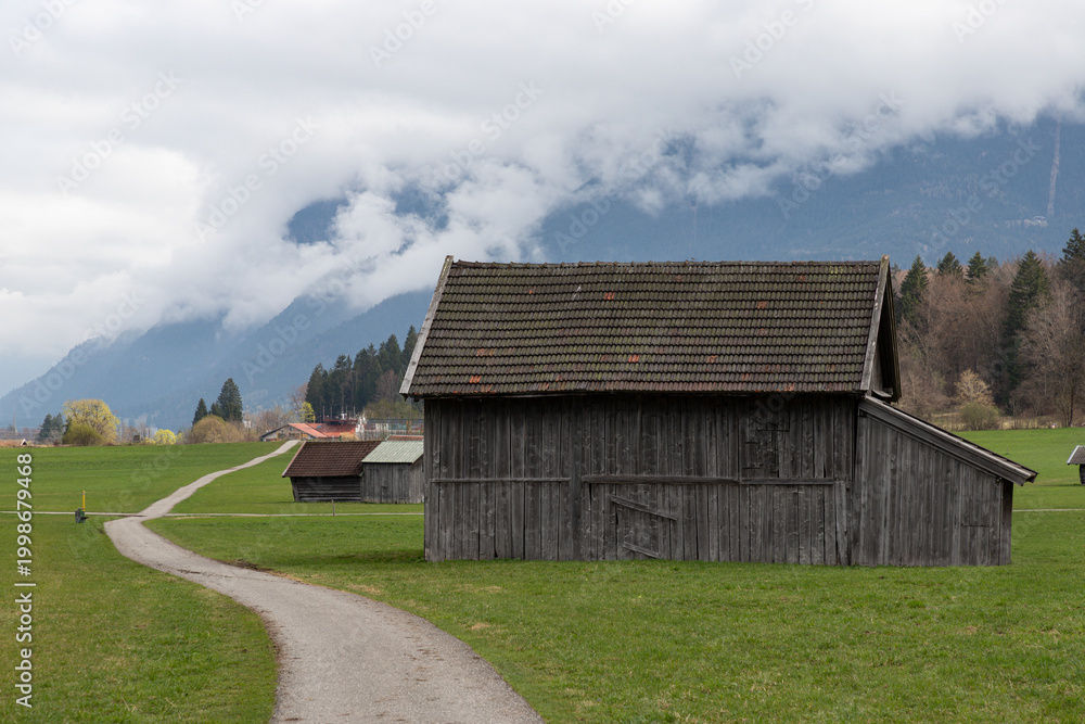 Fototapeta premium Rustic Barn Beside Alpine Path in Bavaria