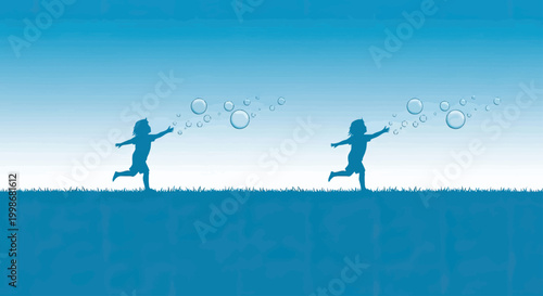 Two children chase bubbles in silhouette against a blue sky and grassy hill