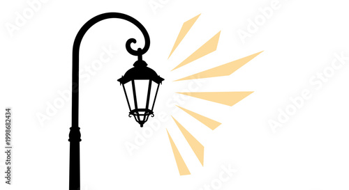 Silhouette of a vintage lamppost emitting rays of light