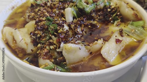 Chinese Water Boiled Fish Footage with Spicy Chili Oil Broth and Sichuan Style Seafood Cuisine