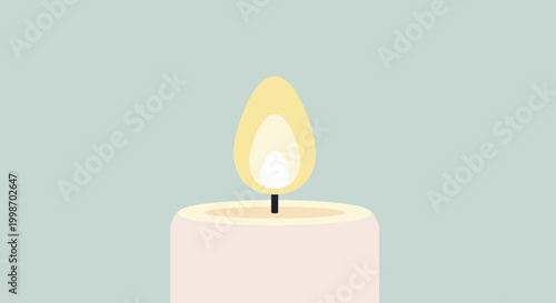 Close up of a lit candle with a bright yellow flame.