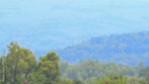 Mountain landscape with soft haze and natural blue tones in the distance