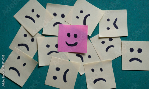 Slika na platnu One happy sticky note among sad faces, positive mindset and mental health concep