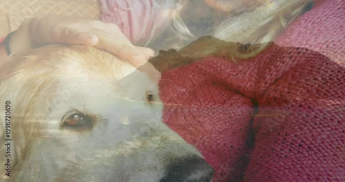 Obraz Petting big dog head with hand on owner wearing red sweater on sofa, with mountain-lake overlay