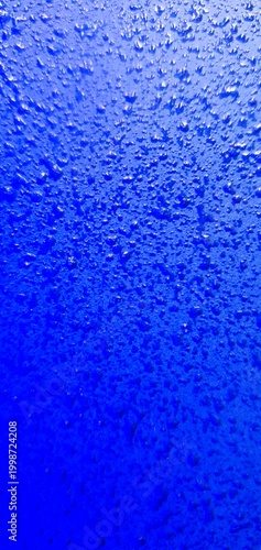 Abstract blue water texture with bubbles and droplets, gradient liquid background, macro underwater surface ideal for design, technology, and creative projects