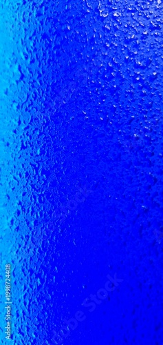 Abstract blue water texture with bubbles and droplets, gradient liquid background, macro underwater surface ideal for design, technology, and creative projects