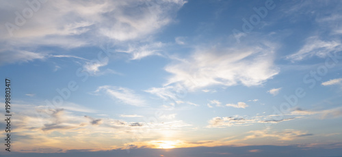 Beautiful morning or evening blue and orange sky with cloudy while sunsets or sunrises taken at the sea used as natural background texture