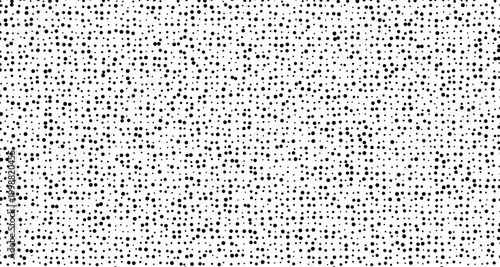 Black dots scattered on a white background pattern