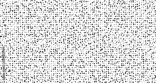 Black dots scattered on a white background pattern