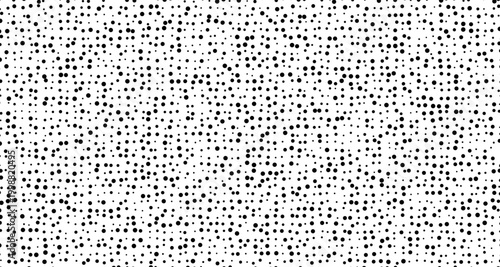 Black dots scattered on a white background pattern