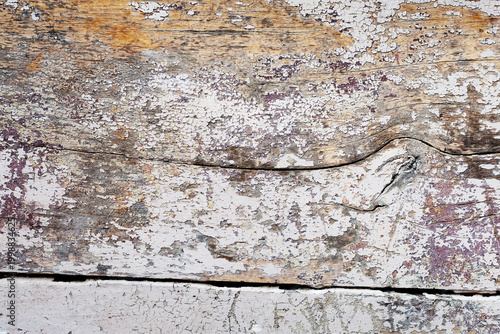 Bild auf Leinwand Detail view of old fading paint and texture on the surface of a very wide wooden