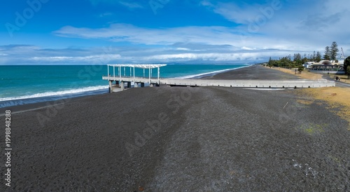 Картината върху платно People visit the Marine Parade viewing platform in Napier, New Zealand, to enjoy the ocean views