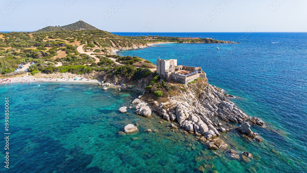 Fototapeta premium Aerial view of the Fortezza Vecchia, a medieval coastal fortress on a rocky promontory in Villasimius, Sardinia, Italy