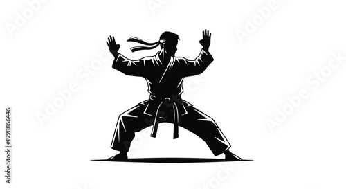 Karate practitioner performs a powerful martial arts stance in this black silhouette.