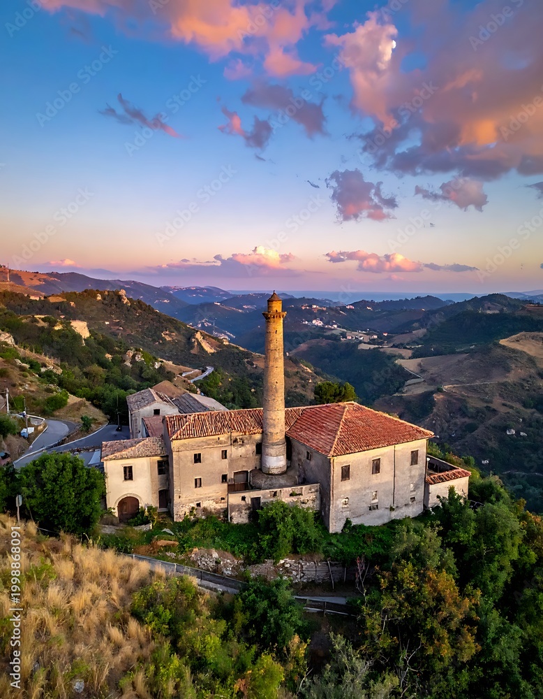 Fototapeta premium A serene landscape of an old building complex on a hilltop