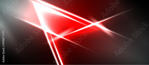 Abstract red light streaks intersect dark background. Brightness creates dynamic visual effect, modern design element.