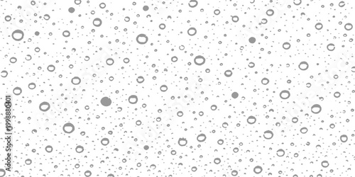 Delicate water droplets glistening, capturing light, creating an intricate pattern. A close-up view of clear water drops. 