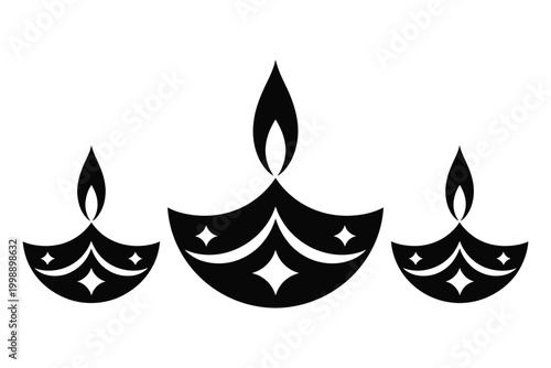 Three decorative black diya lamps