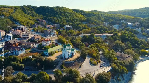Abrau-Diurso, Krasnodar Krai, Russia. Lake Abrau. Embankment and village. Summer. Church of Xenia of Petersburg. Drone footage, Point of interest