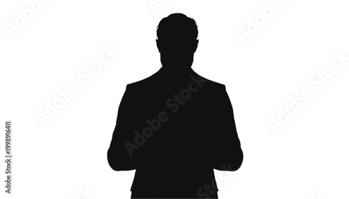 Businessman silhouette stands in a formal suit while looking directly ahead to symbolize corporate leadership, professional authority, and successful management in an office environment.