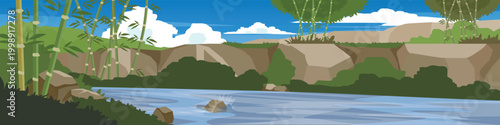 Canal or River flows through a bamboo forest environment. Background consists of rolling hills. Under blue sky and white clouds for banner nature background.