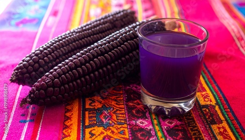 Purple Corn Drink and Fresh Cobs on Colorful Textile.