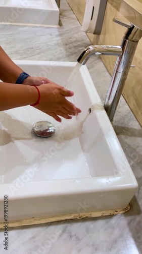 Hand washing sink. Hygiene and cleaning hands. Safety, sanitary or hygiene at home. Prevention of dirt, bacteria or germs in bathroom