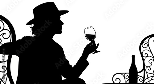 Man in hat drinking wine glass.