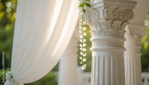 Classic carved pillars with white drapes and jasmine strands