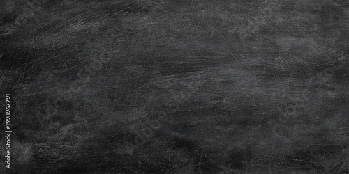 Dark gray wall scratched and distressed textured background with black tones for design and layout