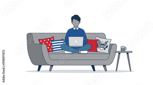 Young man sitting cross-legged on a sofa with a laptop and patriotic pillows