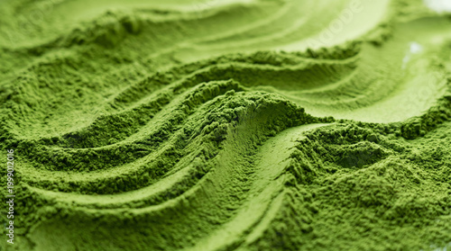 Green powder texture abstract flowing surface wavy pattern macro texture vivid green granular material soft ridge smooth curve close up decorative background