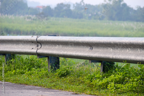Photos Metal guardrail lines a quiet rural road