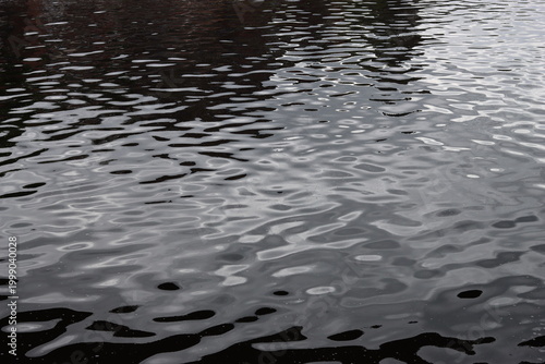 Fotografie Gentle ripples on river water