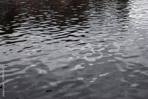 Fotografie Gentle ripples on river water