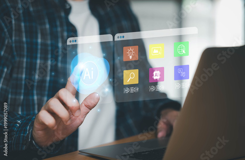 Person interacting with futuristic AI holographic interface featuring multiple artificial intelligence service icons while using a laptop.