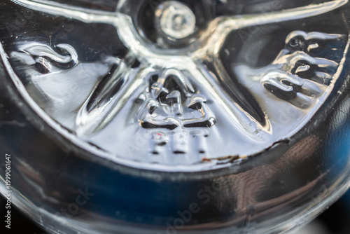 фотографія Closeup of PET recycling symbol on clear plastic bottle sustainability and plast