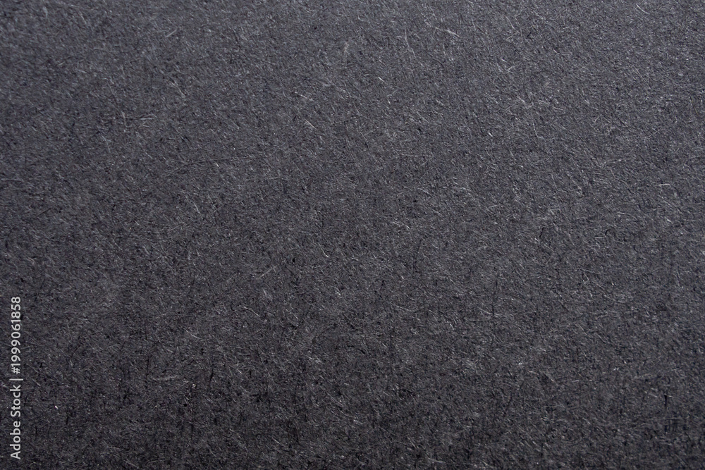 Fototapeta premium Black paper texture background with rough fiber surface and dark grey cardboard pattern