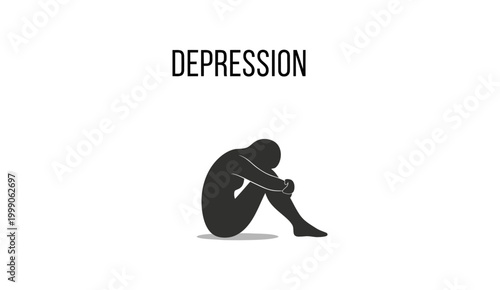 Depression Concept with Silhouette of a Person Sitting Huddled.