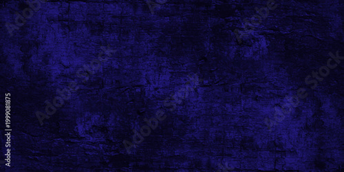 A dark blue vintage grunge texture featuring a rough aged paint pattern on a blank weathered canvas backdrop with subtle purple and black textured paper elements for a grungy wall design