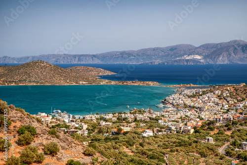 Panoramic view of Elounda bay on Crete with turquoise sea and coastal town