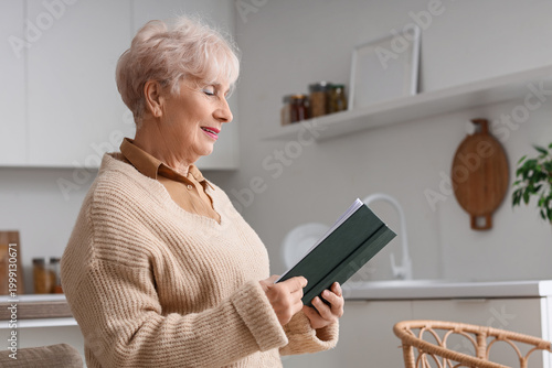 Beautiful senior woman read...