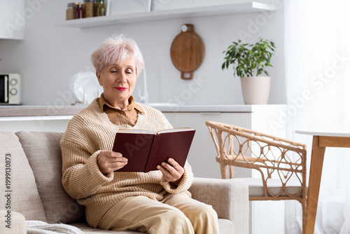 Beautiful senior woman read...