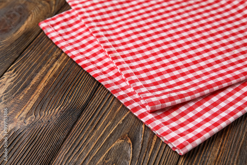 Checkered napkin on wooden ...