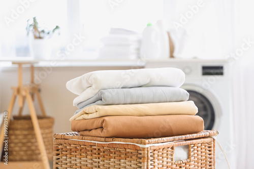 Stack of clean bed sheets o...