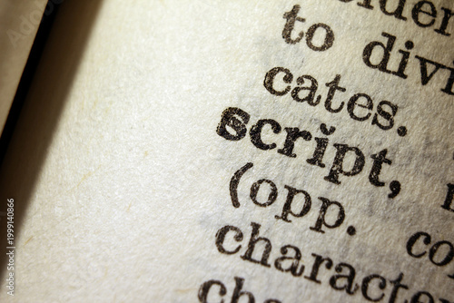 Fotografie Word script on dictionary page, macro close up